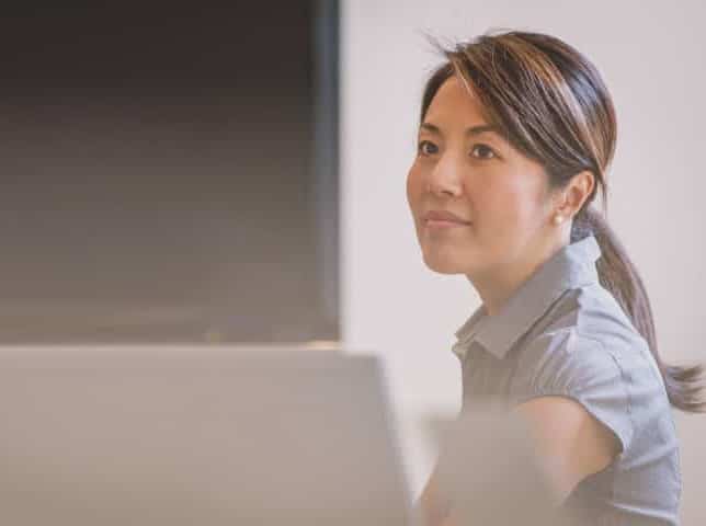 A woman not looking at her screen - translation quality assurance