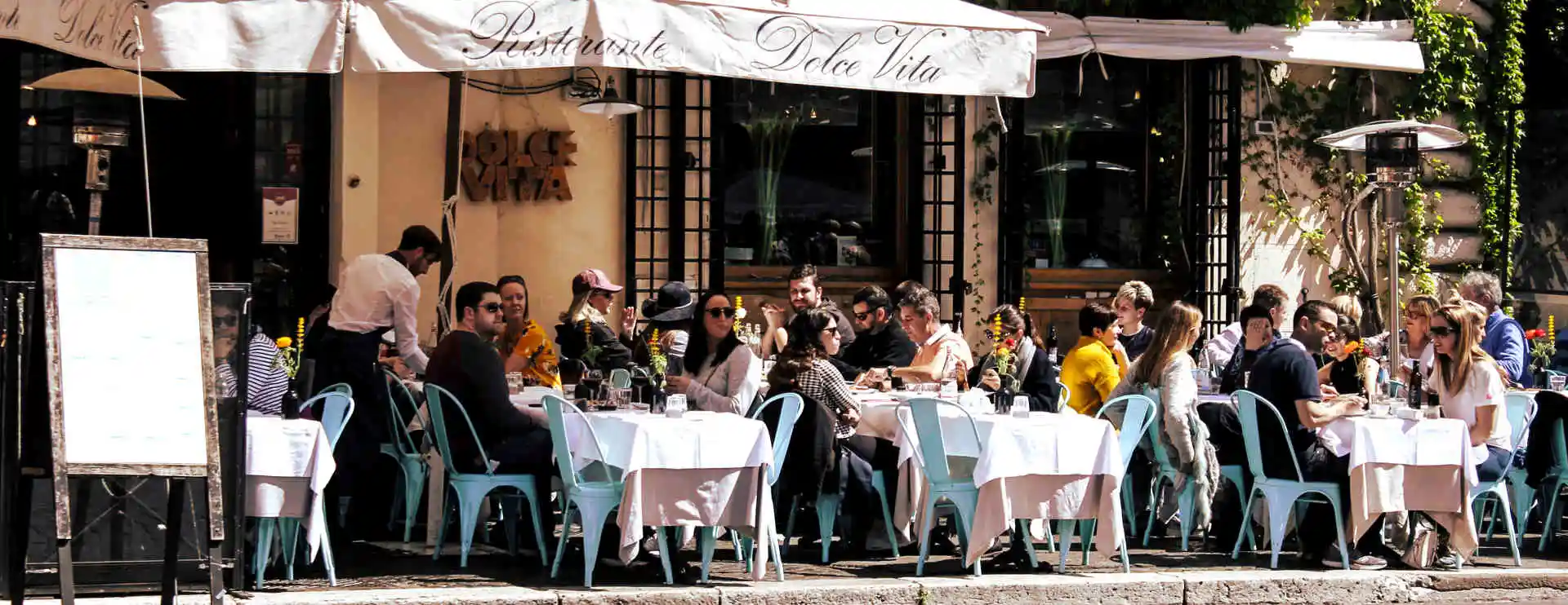 Italians enjoying lunch at a cafe called 'La Dolce Vita'