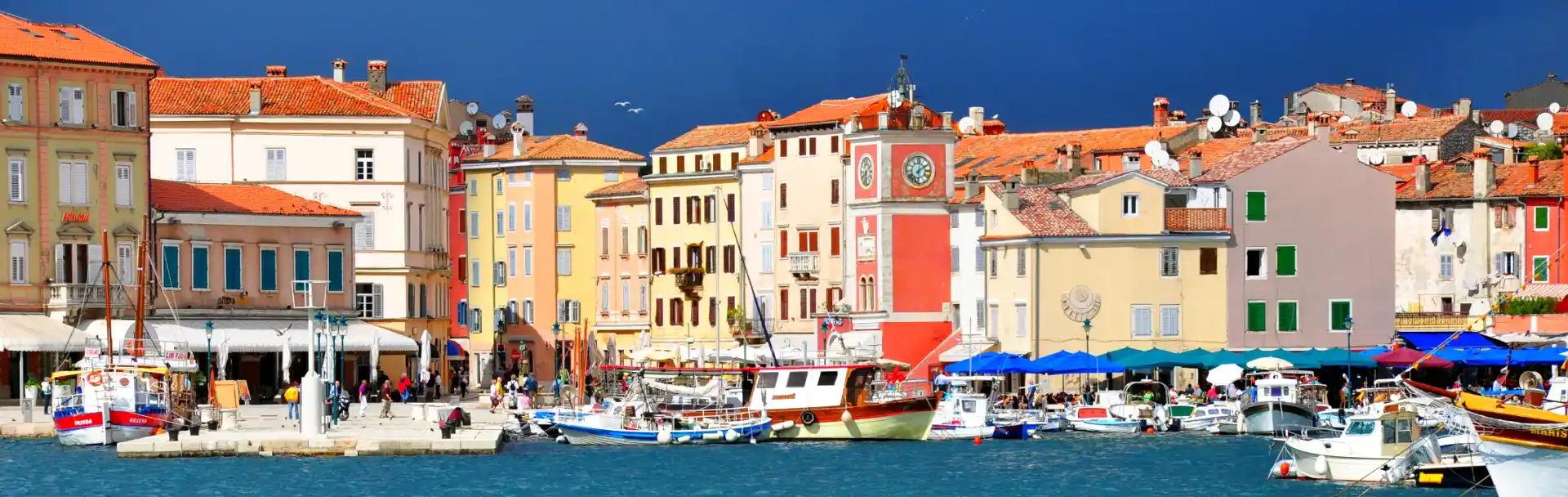 A colourful Croatian Adriatic port with many small boats - Croatian translation