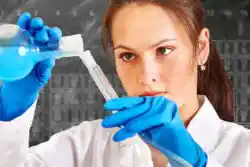 A laboratory worker filling a test tube - references Halifax Translation Agency